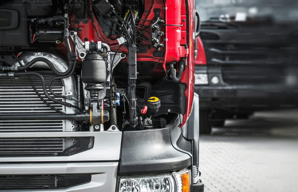 Close-up of a truck engine compartment with visible components.