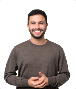 Smiling man in a brown sweater posing against a white background.