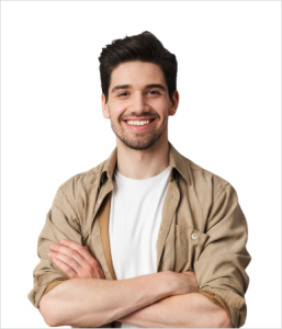 Smiling young man with crossed arms in casual attire.